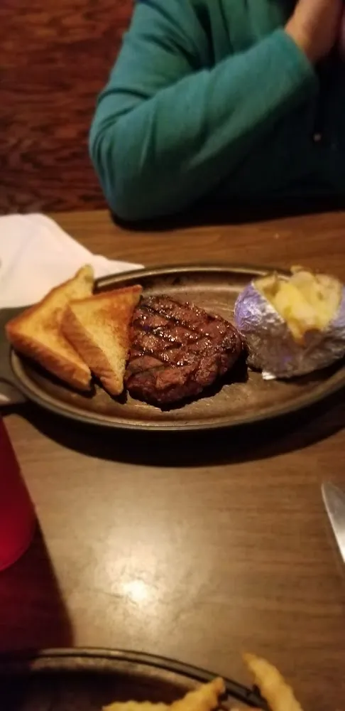Six Ounce Sizzler with Baked Potato and Salad